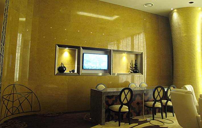 Louis style armchairs and sofa upholstered in a silver stripe fabric in the Seven Luck Casino in Seoul, South Korea