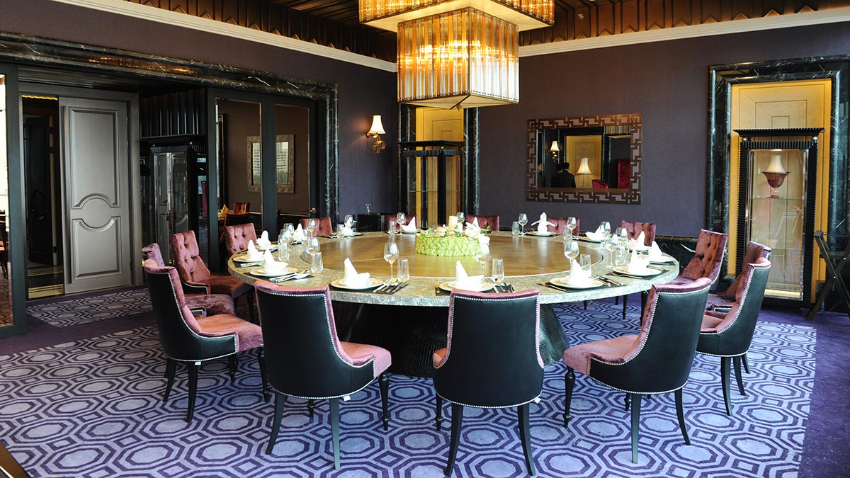 Ramses dining chairs by Sevensedie around a large round table in a private room at the Imperial Seal restaurant in Shanghai