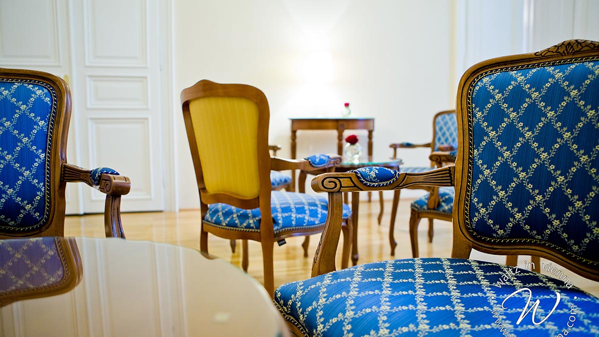 Zeta replica armchairs in baroque style in blue and yellow fabric in the hall of the private dance academies in Vienna, Austria